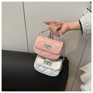 Detail of pink and silver quilted mini chain bags with metallic twist locks and chain handles