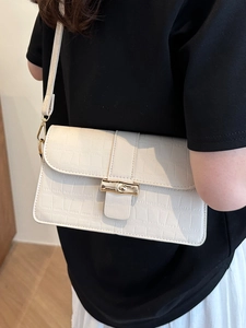 Chic cream crocodile pattern leather crossbody bag with bamboo style gold buckle