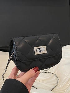 Quilted black mini chain bag with silver twist lock shown in hand for 2025 spring style