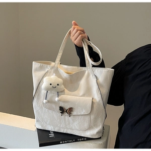 White crumpled texture tote bag with metal butterfly buckle and cloud charm accessory
