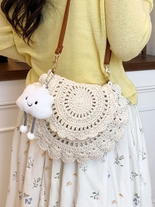 Handmade crochet saddle bag in cream white with brown leather strap and cloud charm