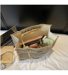 Interior view of large ethnic canvas tote bag showing high capacity for tablets and books