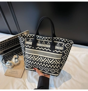 Close-up of geometric pattern canvas tote bag with woven rope handles and urban props