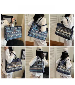 Ethnic style large canvas tote bag showing shoulder and handbag usage by a model