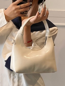 Glossy white patent leather hobo bag with silver metallic zippers for women