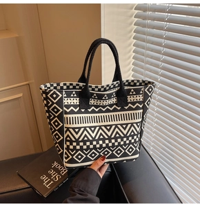 Close-up of bohemian geometric patterns on a large canvas tote bag for commuting