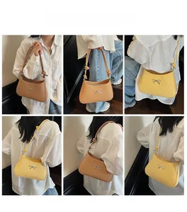 Brown and yellow chic shoulder bags shown in various styling poses on stairs
