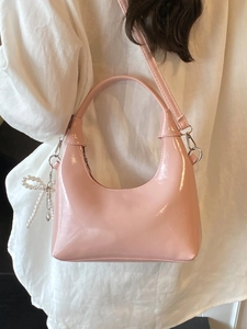 Pink patent leather hobo bag with pearl bow charm and silver hardware accessories