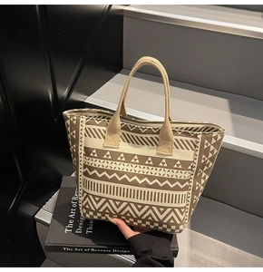 Close-up of geometric pattern canvas tote bag detailing ethnic style and woven handles