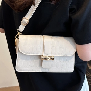 Elegant white crocodile embossed underarm bag with gold bamboo buckle and adjustable strap