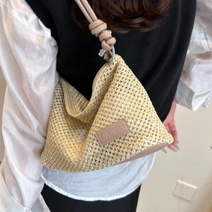 Chic cream woven shoulder bag with leather strap and zipper closure for summer commute