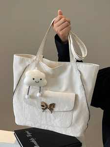 White minimalist large capacity tote bag with butterfly buckle and cloud charm accessory