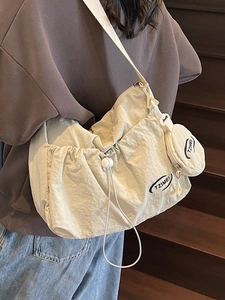 Cream nylon crescent crossbody bag with mini pouch and adjustable strap for women