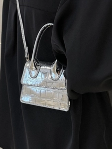Silver metallic crocodile pattern mini handbag with curved handle and crossbody strap