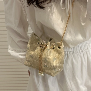 Mini woven straw bucket bag with floral embroidery and gold chain pearl drawstring