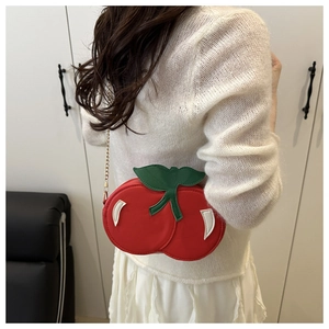 Creative red cherry shaped crossbody bag with green leaves and gold metal chain strap