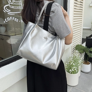 Minimalist silver metallic tote bag with bow detail and large capacity for women