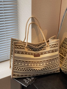 Vintage tribal canvas tote bag with geometric patterns and brown leather fashion patch