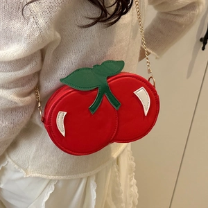 Cute red cherry shaped crossbody bag with green leaf detail and gold chain strap