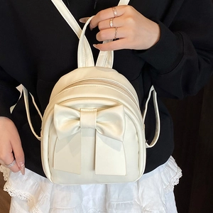 Mini cream bow backpack for women with sleek PU leather and adjustable shoulder straps