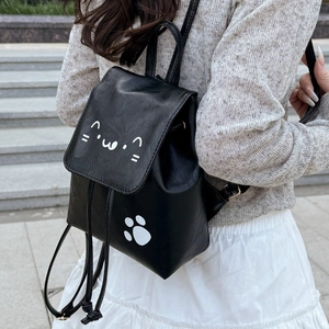 Black PU leather backpack with white cat pattern and drawstring flap on steps