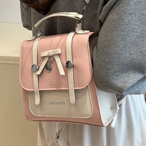 Mini sac à dos femme en cuir rose et blanc avec nœud et pendentif en cœur