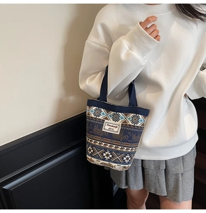 Ethnic style canvas bucket bag with elephant pattern shown in a lifestyle setting