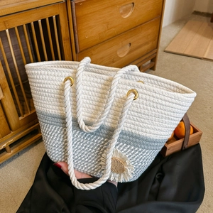 Handmade woven cotton rope tote bag in white and grey with daisy charm detail
