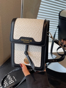 Quilted black and white woven phone crossbody bag with gold logo and thin strap