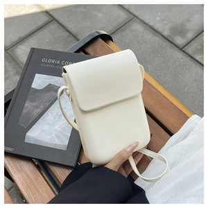 Minimalist white PU leather crossbody phone bag detail with flap closure and slim shoulder strap