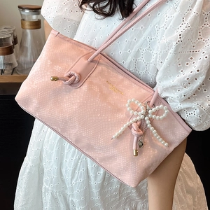 Pink snake pattern shoulder bag with pearl bow charm and elegant french style design