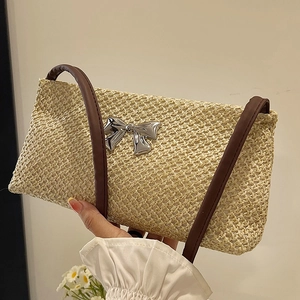 Beige woven crossbody square bag with silver metal bow and brown shoulder strap