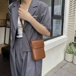 Chic brown PU leather vertical crossbody phone bag for women in minimalist style