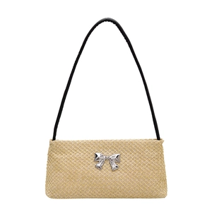 Summer woven beige crossbody bag with silver bow accent and slim black shoulder strap