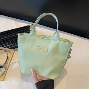Light green water-resistant nylon tote bag with fashion patch for casual daily use