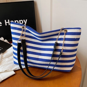 Classic blue and white striped tote bag with black leather and gold chain straps