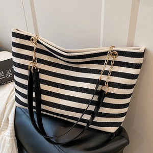 Striped canvas tote bag with gold chain straps for casual daily commute wear