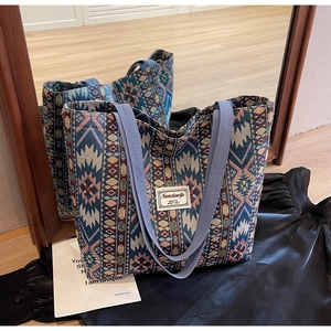 Detailed view of ethnic woven tote bag with colorful patterns and durable canvas straps