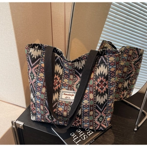 Detail of colorful ethnic geometric jacquard tote bag with mirror reflection view