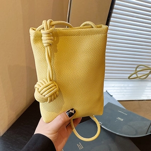 Chic pale yellow lychee texture leather phone bag with woven knot strap details