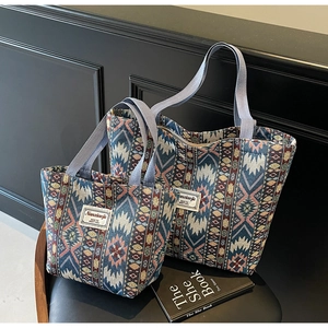 Close-up of geometric ethnic pattern weaving on large and small tote bags set