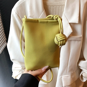 Chic lime green litchi grain leather crossbody phone bag with knot detail and shoulder strap
