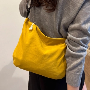 Minimalist bright yellow waterproof nylon crossbody bag for women with adjustable strap