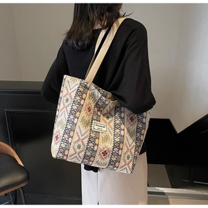 Close-up of geometric ethnic woven patterns on a large capacity vintage tote bag