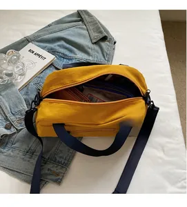 Top view of yellow nylon tote bag interior showing large capacity and inner pocket