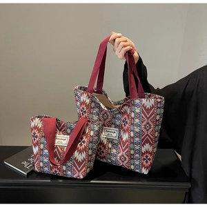 Detail view of ethnic canvas tote bag set with geometric patterns and woven handles