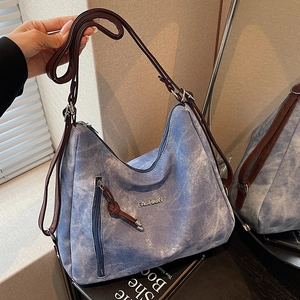 Retro blue washed denim large tote bag with brown leather straps and metal fashion logo