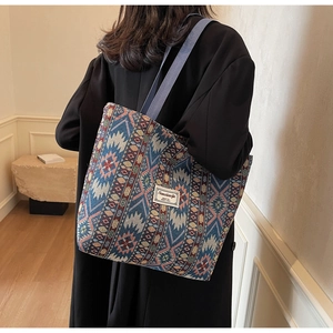 Close-up of ethnic tote bag with woven geometric patterns and durable fabric texture