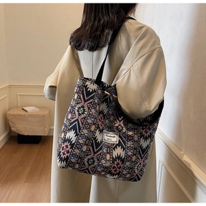 Close-up of woven ethnic pattern and fabric texture on large bohemian tote bag