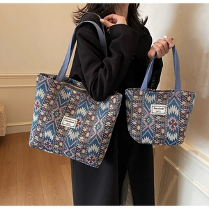 Detailed view of bohemian jacquard tote bags in two sizes with ethnic blue patterns